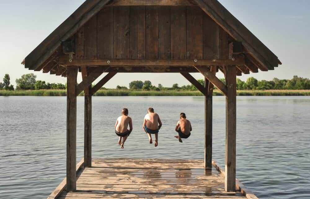 Jumping into Stara Drava from the beach jetty in Draž 